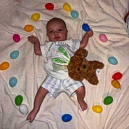Atlas joined the competition — help win amazing prizes! baby, blanket, celebration, child, clothing, colorful, cute, easter, easter_eggs, festive, heart_shape, holiday, indoor, lying_down, plush_toy, soft_texture, striped_shorts, teddy_bear, toddler, toy
