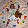 Atlas joined the competition — help win amazing prizes! baby, blanket, teddy_bear, easter_eggs, easter, toddler, child, toy, colorful, cute, lying_down, clothing, striped_shorts, plush_toy, soft_texture, indoor, celebration, holiday, heart_shape, festive