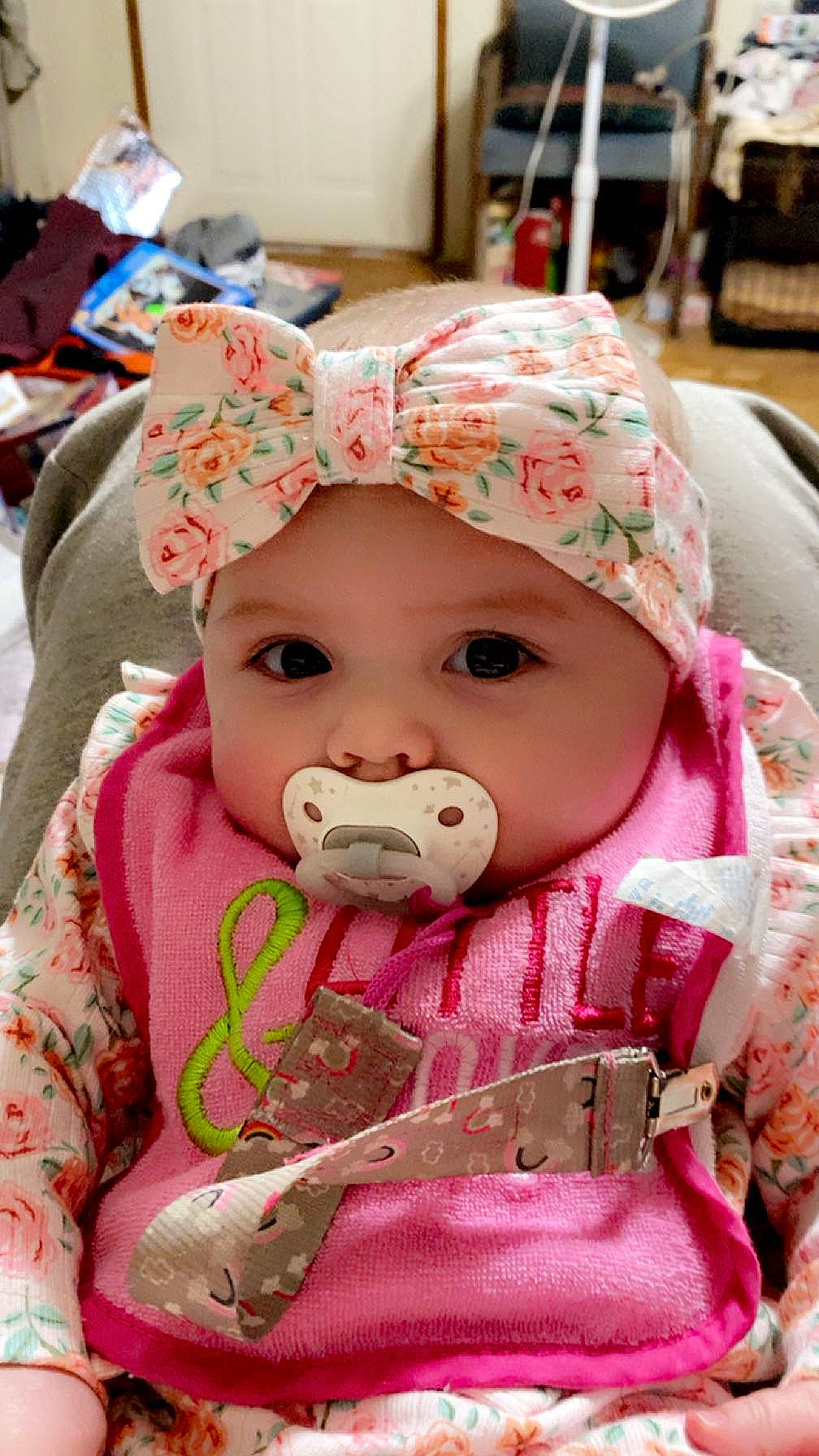 Arya is registered to the contest to win money with this photo: baby, baby_toddler_clothing, cheek, chin, dress, eye, face, hat, head, headgear, headwear, jacket, lip, mouth, nose, outerwear, person, pink, skin, sleeve