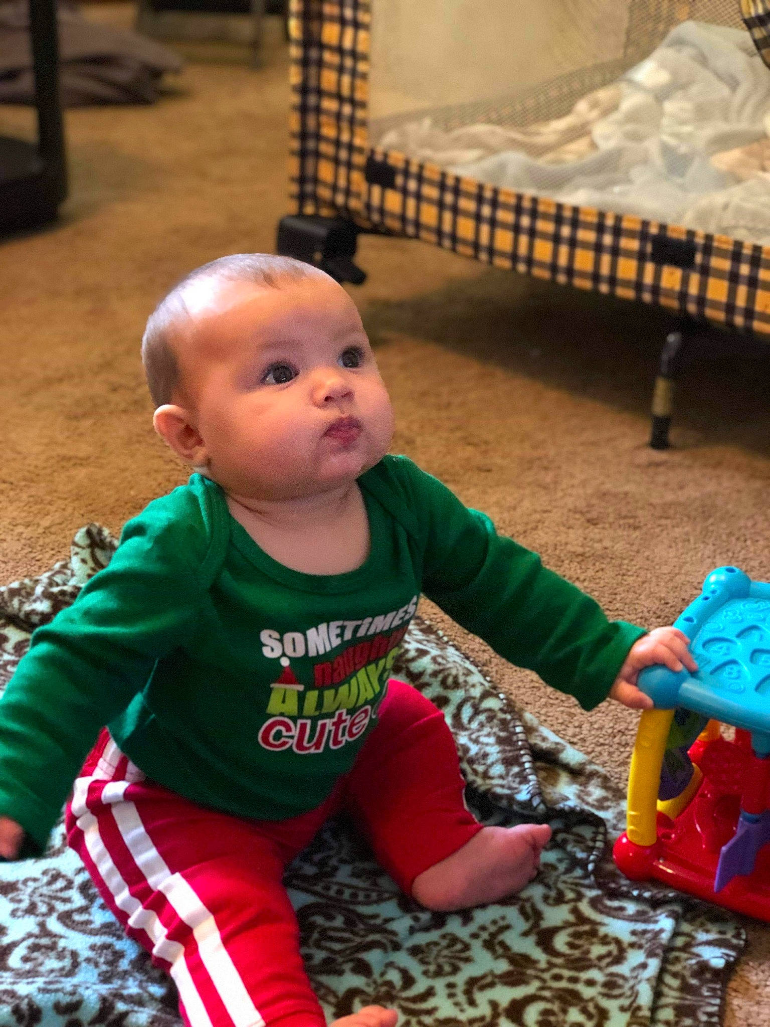 Jessie is registered to the contest to win money with this photo: child, christmas, day, fun, holiday, infant, person, play, product, skin, toddler