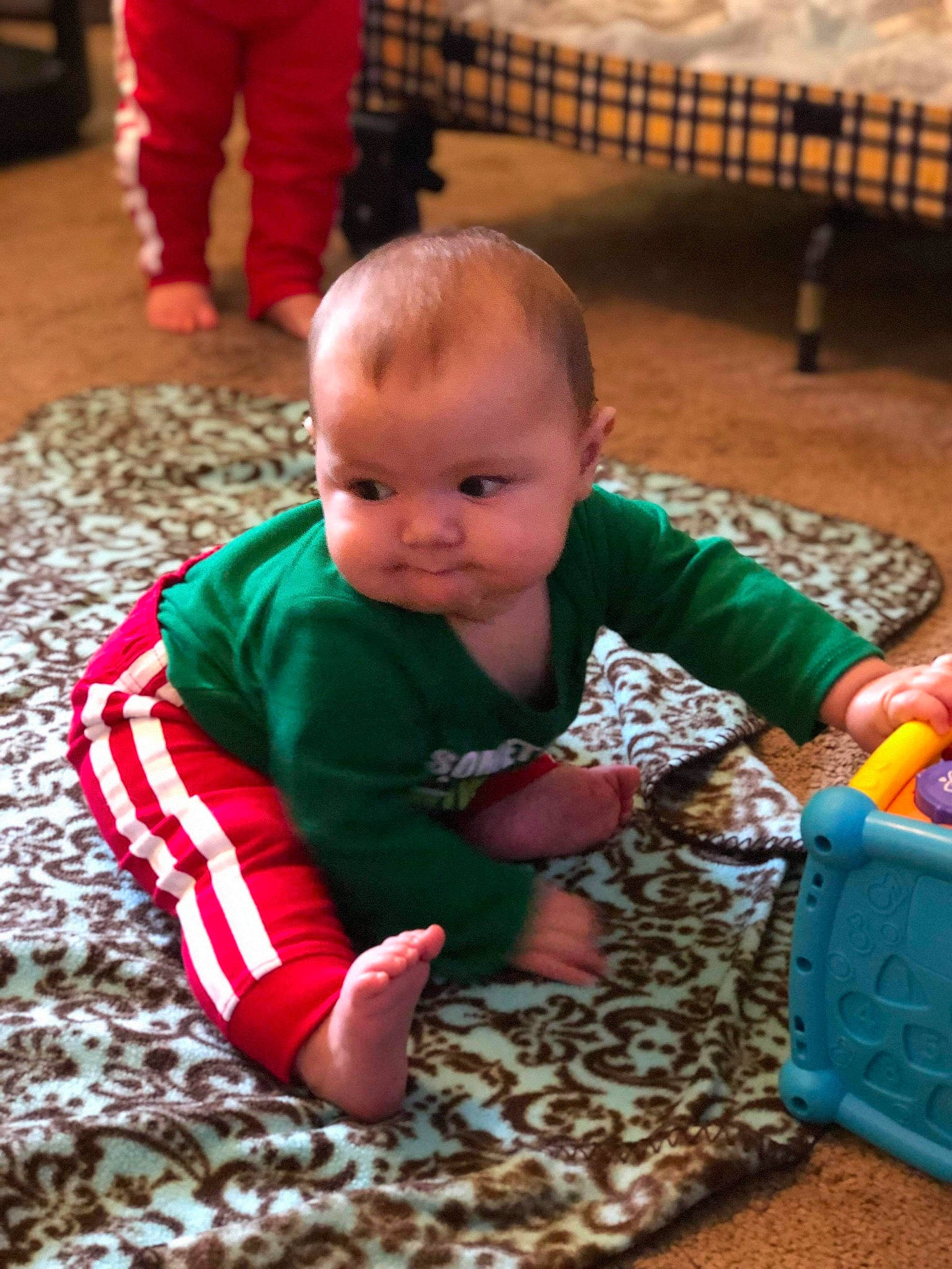 Jessie is registered to the contest to win money with this photo: baby, child, person, play, sitting, toddler, tummy_time