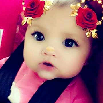 Jessie joined the competition — help win amazing prizes! baby, beauty, cheek, child, doll, eye, face, flower, hair_accessory, head, headgear, headpiece, lip, mouth, nose, person, petal, pink, plant, skin