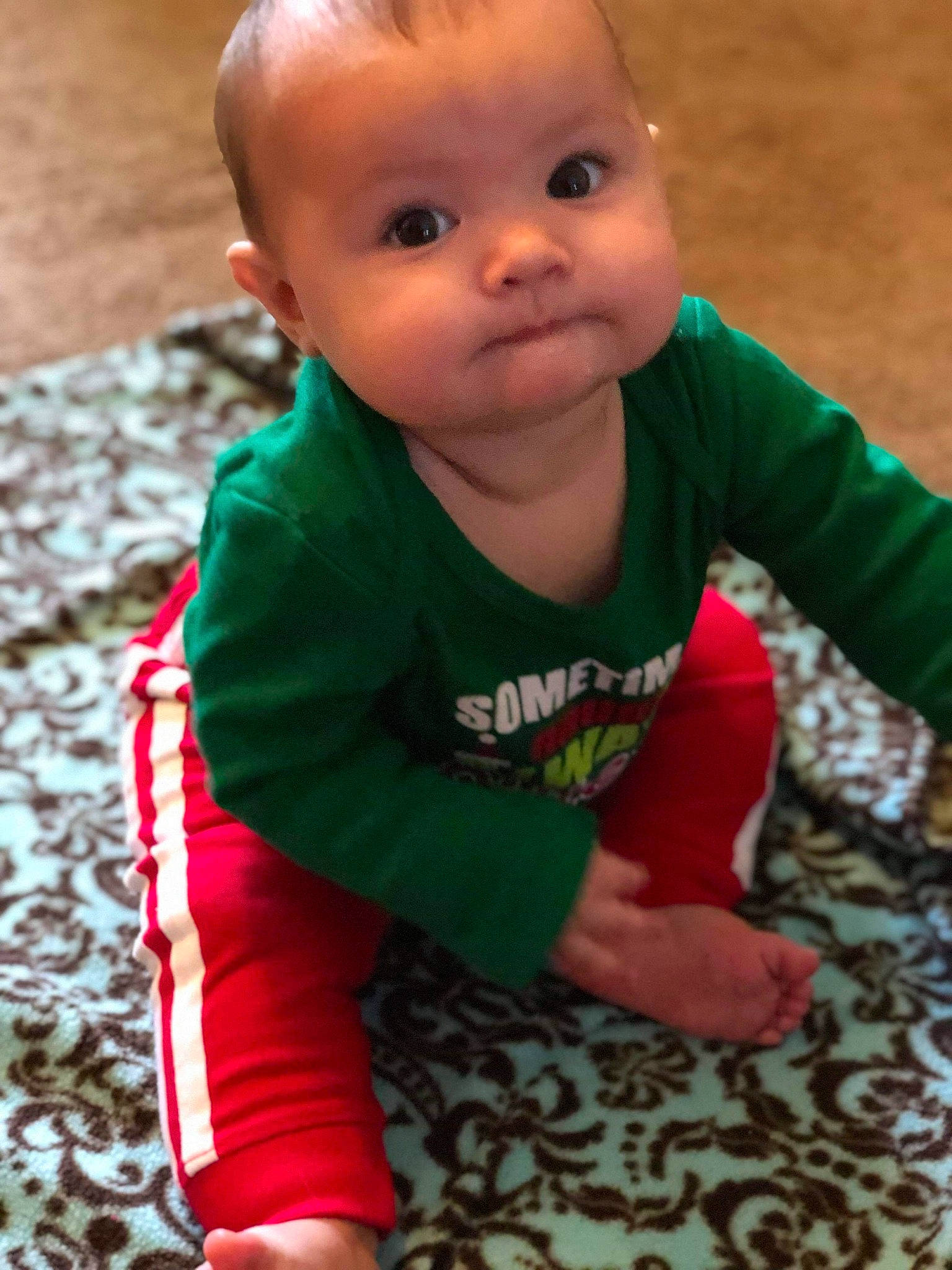 Jessie is registered to the contest to win money with this photo: baby, baby_toddler_clothing, cheek, child, face, green, head, lip, person, play, skin, smile, toddler