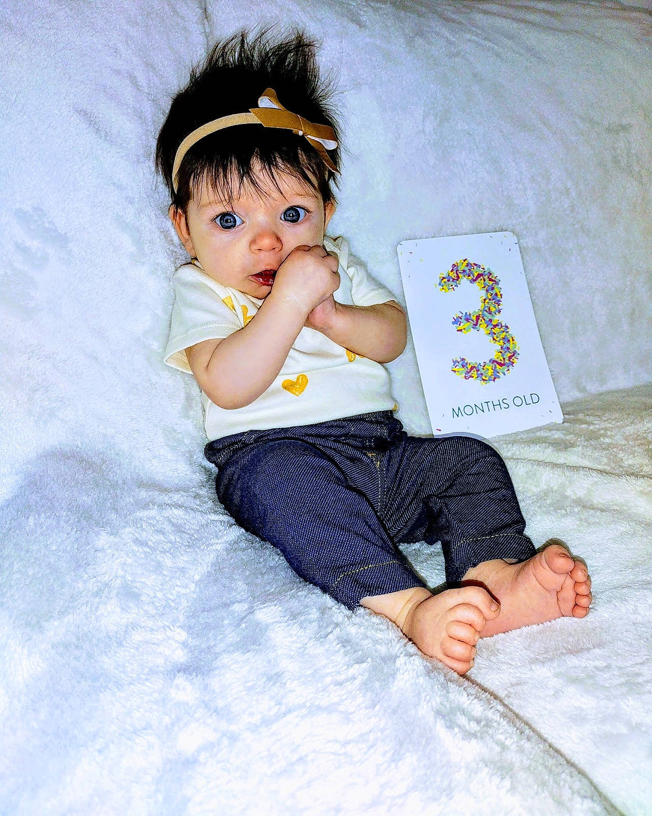 Ariyah is registered to the contest to win money with this photo: arm, baby_toddler_clothing, barefoot, child, comfort, eye, fashion_design, flash_photography, foot, fun, happy, human_leg, linens, pattern, person, sitting, skin, sleeve, textile, thigh