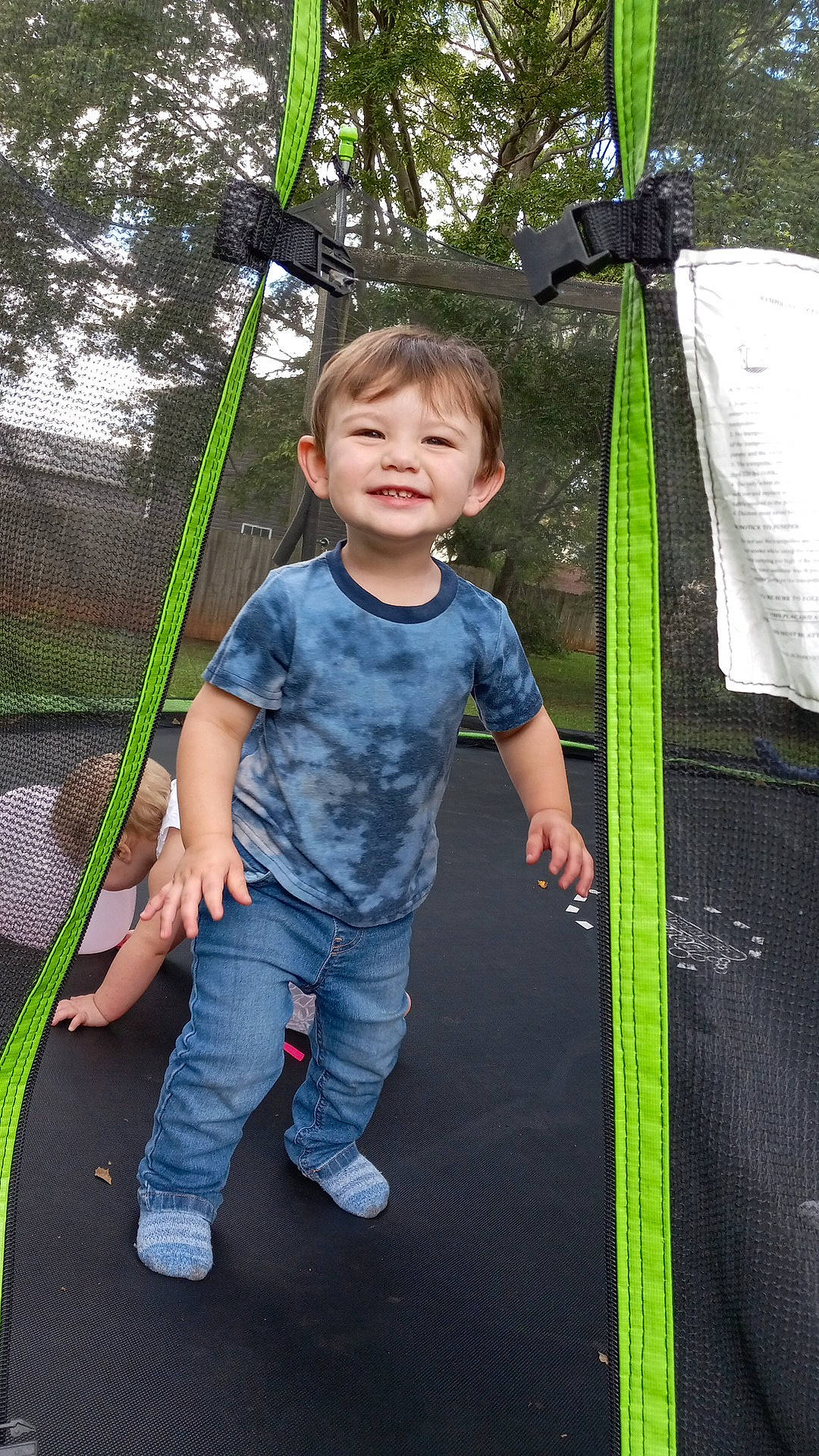 David is registered to the contest to win money with this photo: baby, child, city, electric_blue, fun, grass, happy, joy, leisure, outdoor_play_equipment, person, plant, play, playground, product, recreation, smile, swing, t_shirt, toddler