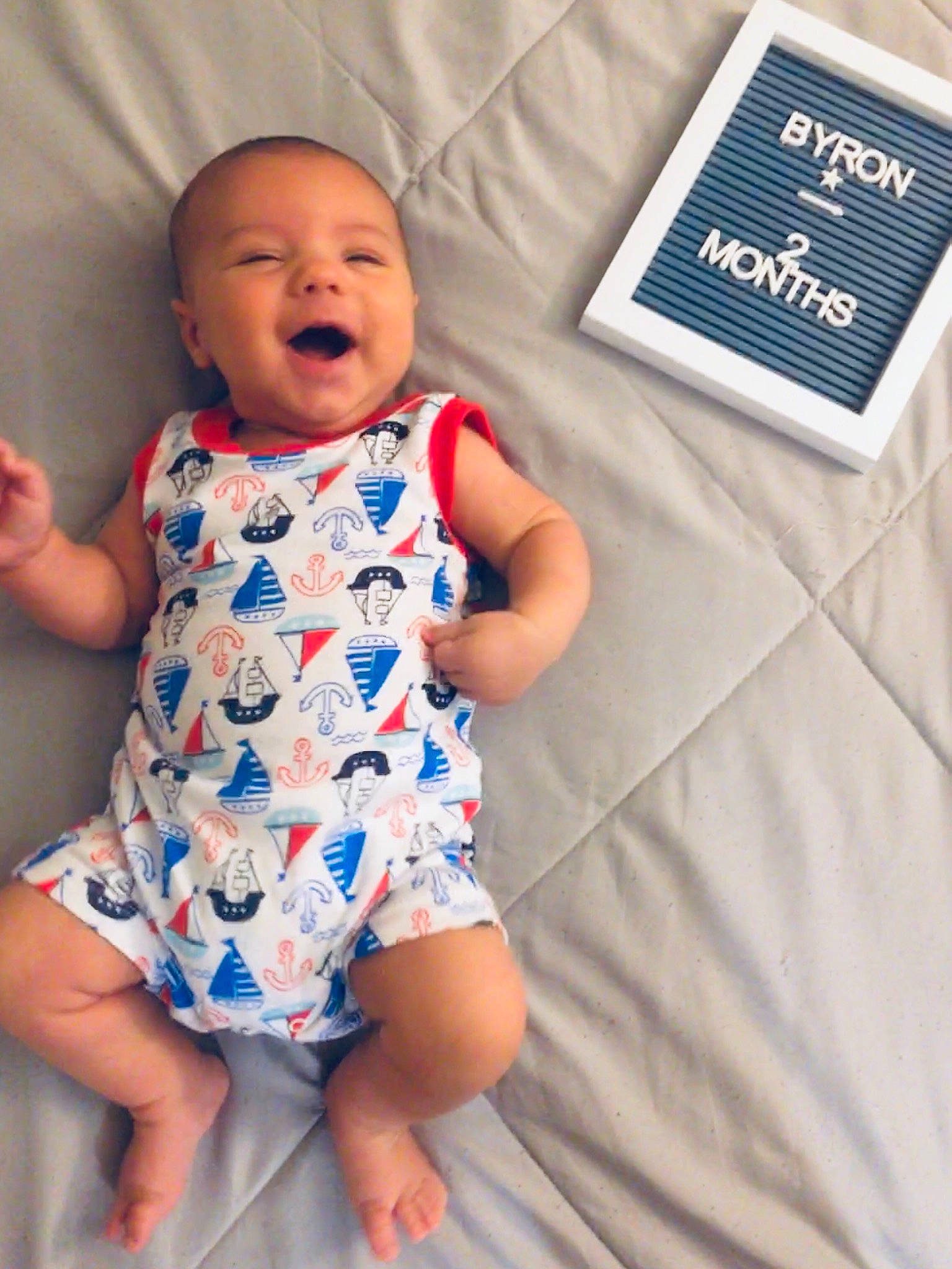 Byron is registered to the contest to win money with this photo: azure, baby, baby_toddler_clothing, child, day_dress, design, dress, electric_blue, fun, happy, linens, one_piece_garment, pattern, person, portrait_photography, product, sleeve, t_shirt, textile, thumb