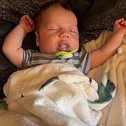 Easton is registered to the contest to win money with this photo: baby, bed, blanket, child, clothing, comfort, cozy, cute, indoors, infant, pacifier, peaceful, pillow, portrait, relaxing, resting, sleeping, soft, toddler, young