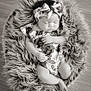 baby, infant, sleeping, headband, bow, floral_outfit, fur_bed, cozy, portrait, black_and_white, peaceful, cute, toddler, child, soft_texture, wooden_floor, resting, adorable, small_hands, small_feet