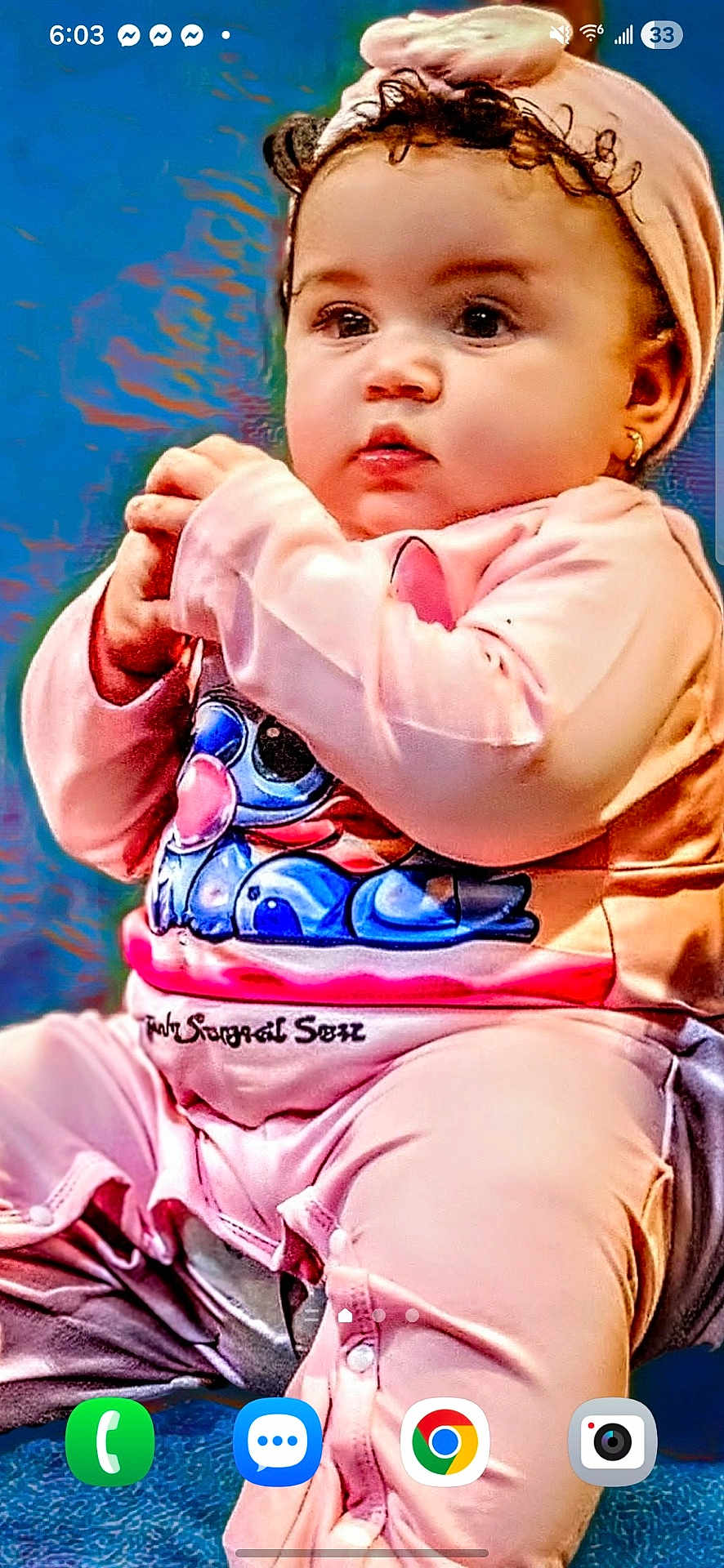 Jaliyah joined the competition — help win amazing prizes! baby, child, pink_clothing, headband, sitting, curly_hair, earrings, portrait, indoor, cute, closeup, phone_screenshot, apps, phone_ui, hand_clasp, expression, face, person, infant, casual