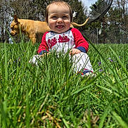 Rowan joined the competition — help win amazing prizes! animal, baby, child, cute, dog, grass, greenery, happy, nature, outdoor, pet, playful, puppy, sitting, sky, smiling, sunlight, trees, yard, young_child