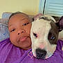 Mask is registered to the contest to win money with this photo: affection, animal, calm, closeup, companion, couch, dog, face, friendship, head, human, indoor, love, person, pet, pit_bull, purple_shirt, relaxed, resting, snuggling