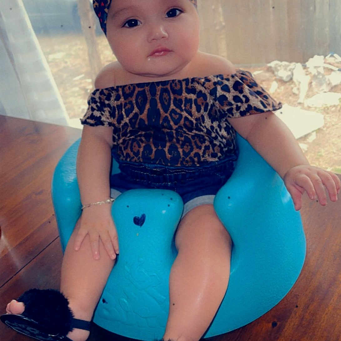 Serenity is registered to the contest to win money with this photo: aqua, azure, baby, baby_toddler_clothing, cap, child, electric_blue, headgear, human_leg, knee, magenta, pattern, pink, shoe, sleeve, sportswear, standing, textile, thigh, white