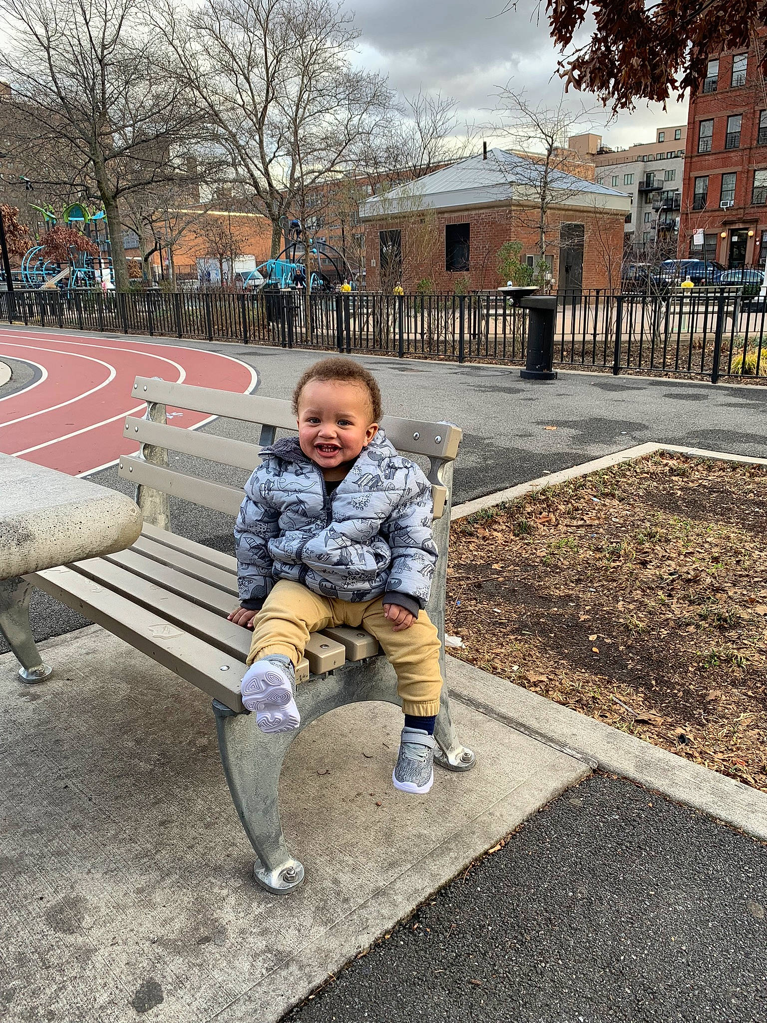 Landyn is registered to the contest to win money with this photo: asphalt, bench, city, fun, grass, happy, joy, leisure, outdoor_bench, outdoor_furniture, pedestrian, people_in_nature, person, recreation, road, road_surface, sidewalk, sitting, sky, street