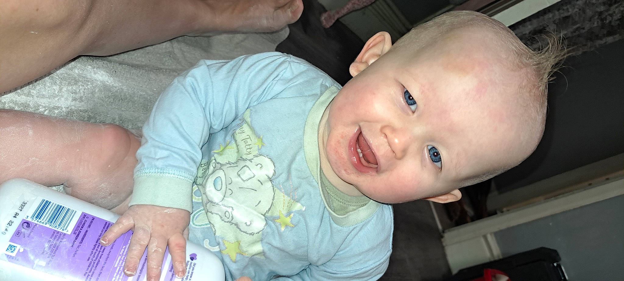 Riley is registered to the contest to win money with this photo: baby, baby_toddler_clothing, cheek, chin, ear, eye, eyebrow, facial_expression, finger, hairstyle, hand, head, human_body, iris, joy, lip, mouth, nose, person, product