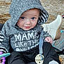 Avery joined the competition — help win amazing prizes! baby, hoodie, pacifier, outdoor, child, smile, sitting, toy, footwear, sock, person, clothing, cute, face, expression, hood, playful, casual, infant, daylight
