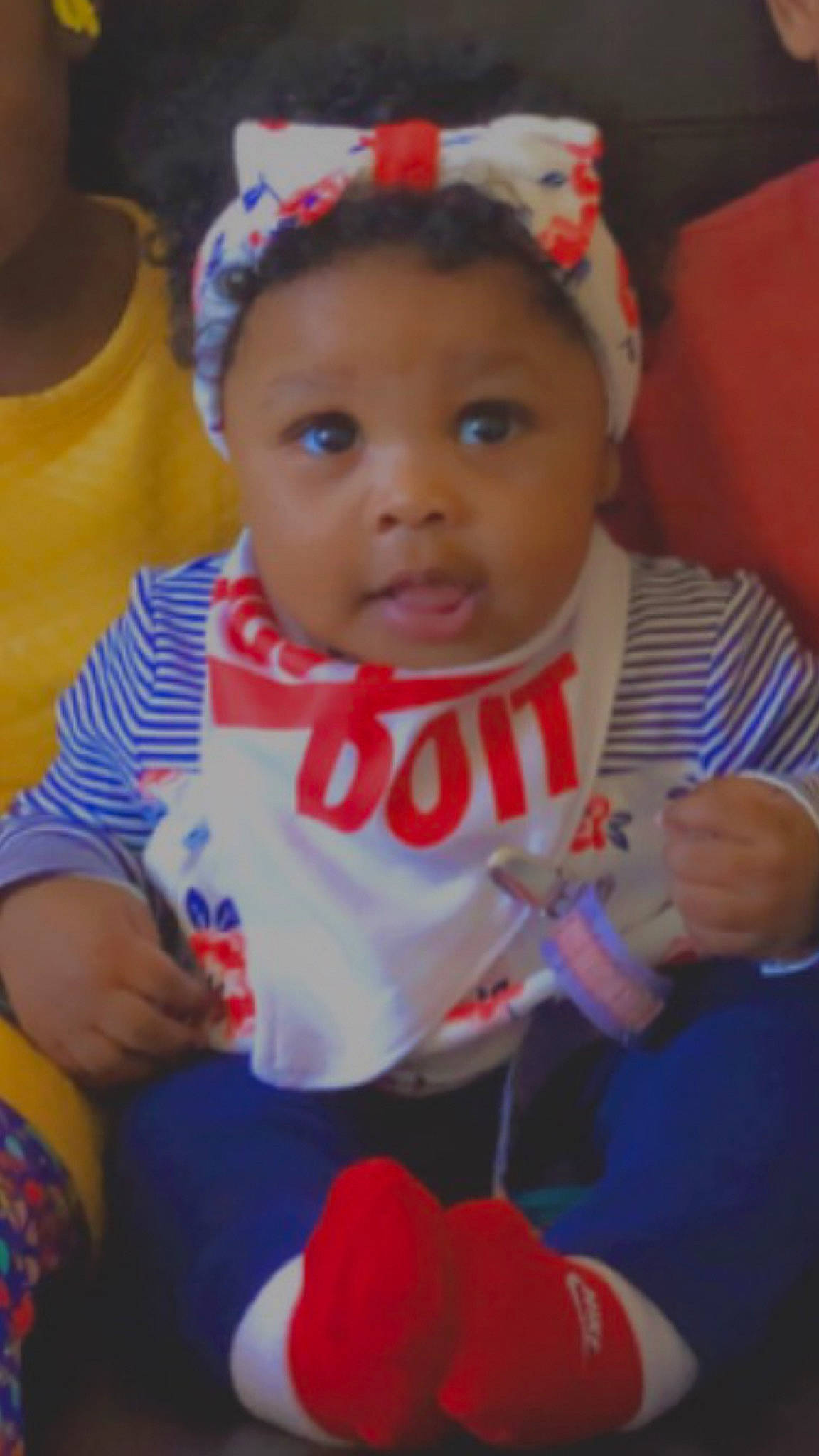 Saniyah is registered to the contest to win money with this photo: baby, baby_products, baby_toddler_clothing, bib, cheek, child, costume_accessory, hair_accessory, hand, headband, headpiece, headwear, human, nail, person, toddler