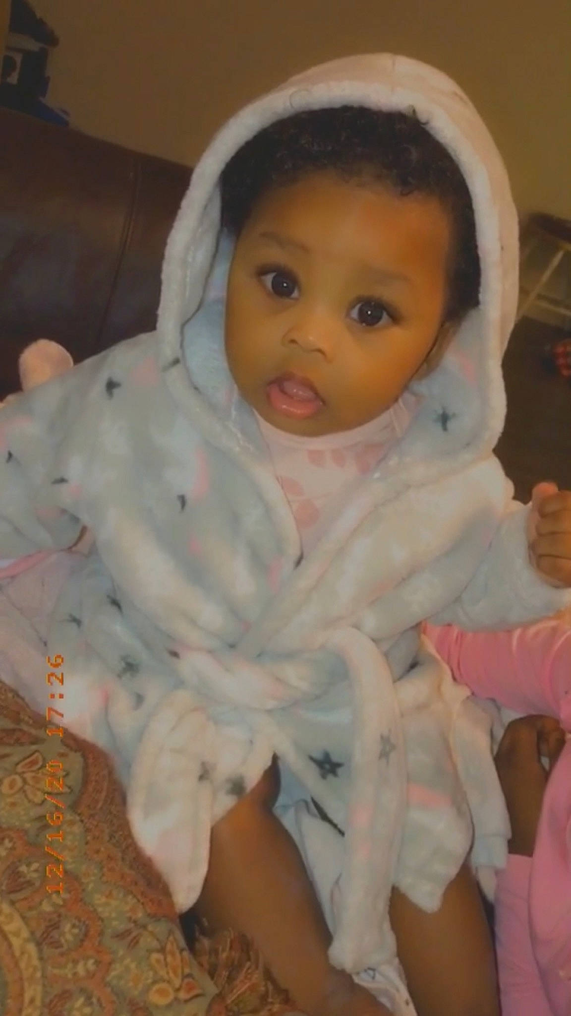 Saniyah is registered to the contest to win money with this photo: baby, baby_products, baby_toddler_clothing, cheek, child, comfort, eyebrow, hood, linens, nose, peach, person, skin, surprise, toddler