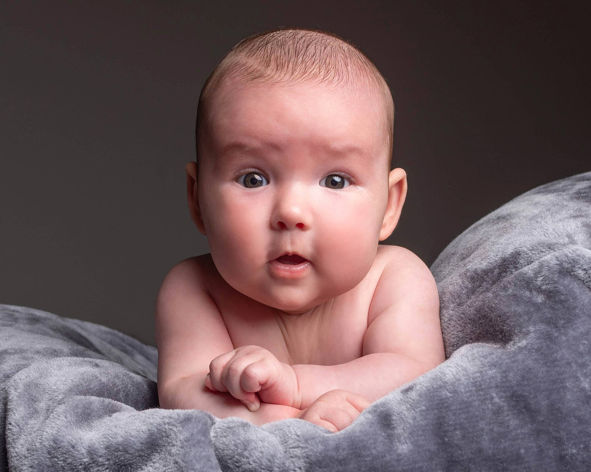 Josephine is registered to the contest to win money with this photo: arm, baby, baby_toddler_clothing, cheek, chest, child, close_up, comfort, eye, face, flash_photography, gesture, happy, head, human_body, nail, nose, person, stomach, thumb