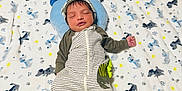 Jason joined the competition — help win amazing prizes! baby, newborn, sleeping, blanket, striped_clothing, hat, bed, pillow, pattern, dog_print, infant, cute, cozy, soft, child, rest, peaceful, indoors, laying_down, comfortable