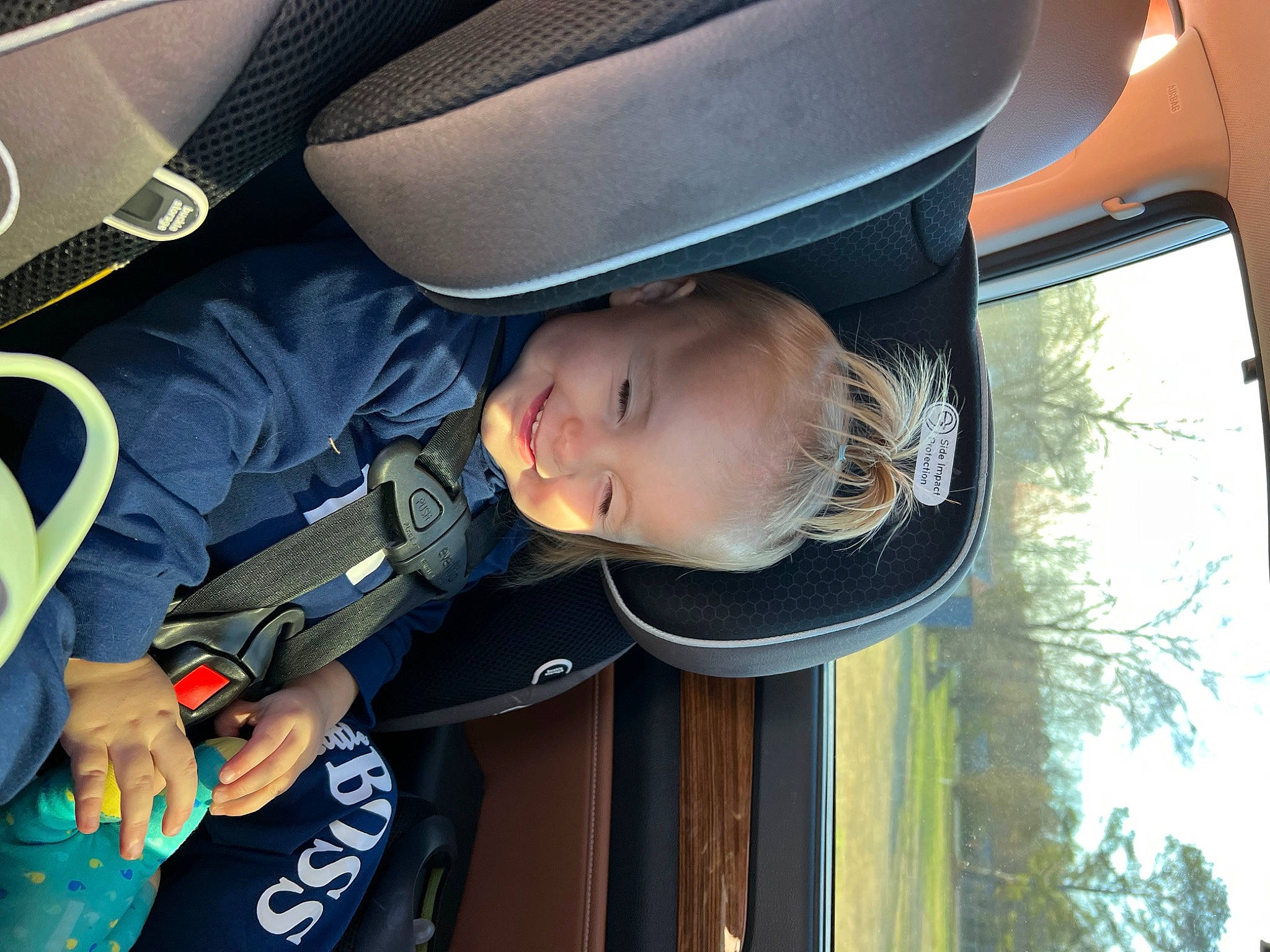 Katerina is registered to the contest to win money with this photo: auto_part, automotive_exterior, baby, baby_products, baby_toddler_clothing, beauty, car_seat, child, comfort, door, family_car, fun, joy, luxury_vehicle, person, smile, sunglasses, tints_and_shades, toddler, tree