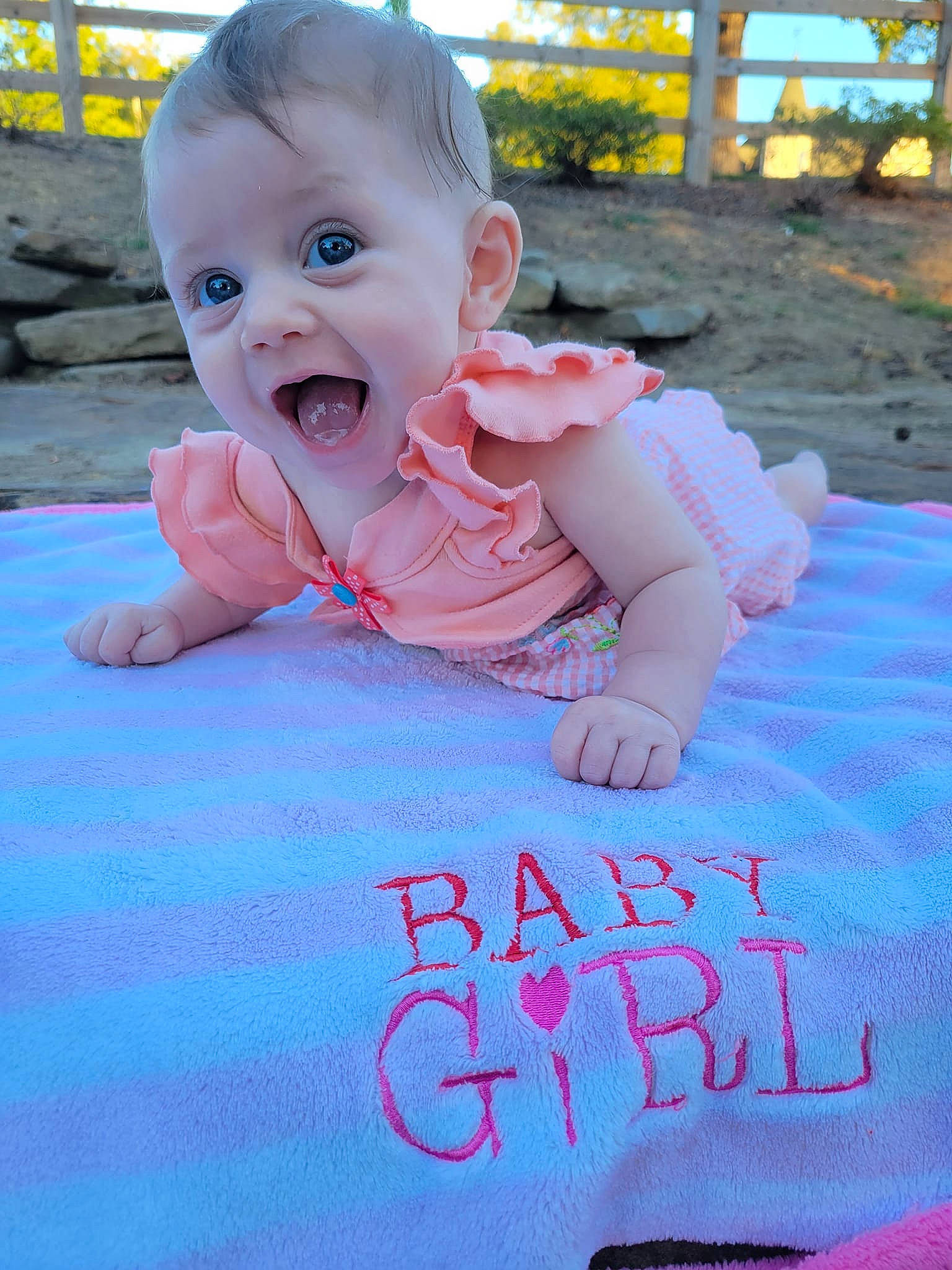 Sierrah is registered to the contest to win money with this photo: azure, baby, baby_toddler_clothing, cheek, child, crawling, electric_blue, eye, finger, flooring, fun, grass, handwriting, happy, person, pink, product, sitting, skin, smile