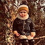 Elio a rejoint le concours — aidez-le/la à gagner de superbes lots ! autumn, beanie, brown_tones, casual_clothing, child, denim_jacket, forest, ivy, knee_pads, leaves, nature, outdoor, person, pom_pom, portrait, scarf, shoes, toddler, tree_branch, winter_wear