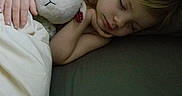Mattie is registered to the contest to win money with this photo: child, sleeping, stuffed_animal, blanket, bed, hand, cozy, soft_toy, comfort, rest, cute, indoor, peaceful, pajamas, face, hair, relaxation, close_up, cuddle, nap
