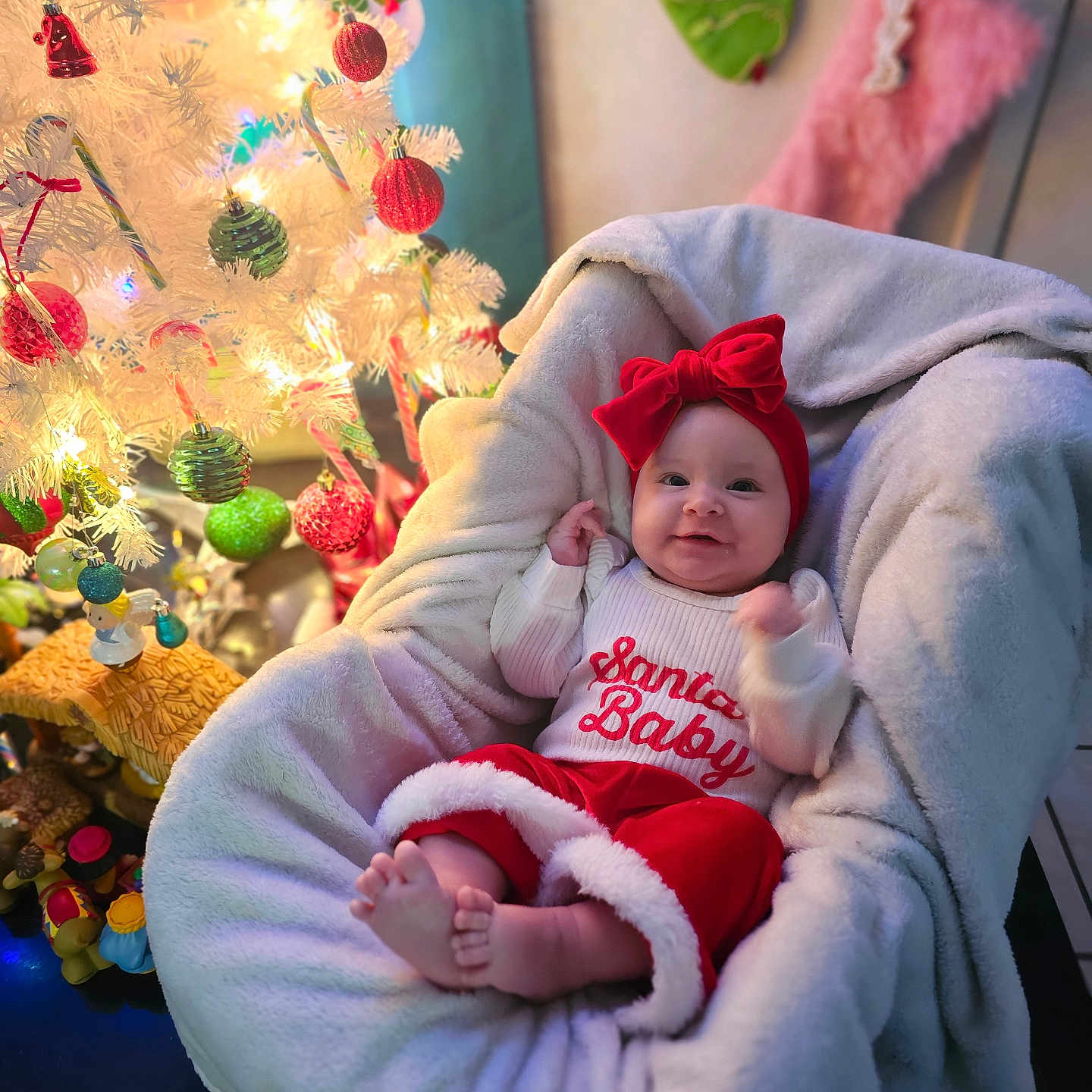 Maesyn joined the competition — help win amazing prizes! baby, blanket, candy_cane, celebration, christmas, christmas_tree, cozy, cute, decorations, festive, happy, holiday, indoors, infant, ornaments, plush_chair, red_bow, smiling, stocking, white_tree