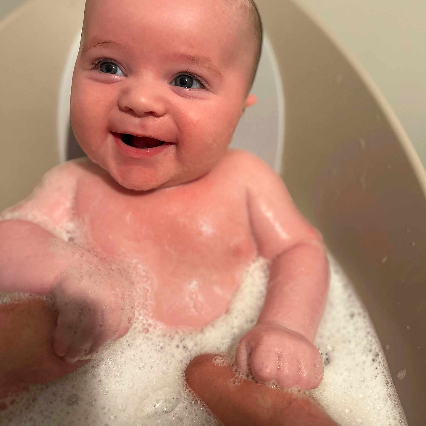 Rhue is registered to the contest to win money with this photo: baby, babylaughing, bathing, bathtub, bodypart, bubble, face, finger, hand, happy, head, laughing, newborn, person, photography, portrait, smile, tub, washing