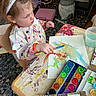 Phoebe joined the competition — help win amazing prizes! child, painting, watercolor, brush, art, colorful, smock, headband, table, palette, paint, messy, creative, indoor, person, young, focused, craft, artwork, expression