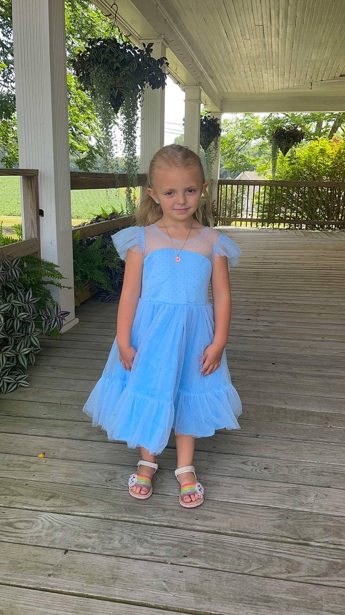 Kaliyah is registered to the contest to win money with this photo: baby_toddler_clothing, child, cocktail_dress, day_dress, dress, electric_blue, eye, flooring, formal_wear, fun, grass, happy, human_leg, joy, one_piece_garment, pattern, person, plant, toddler, tree