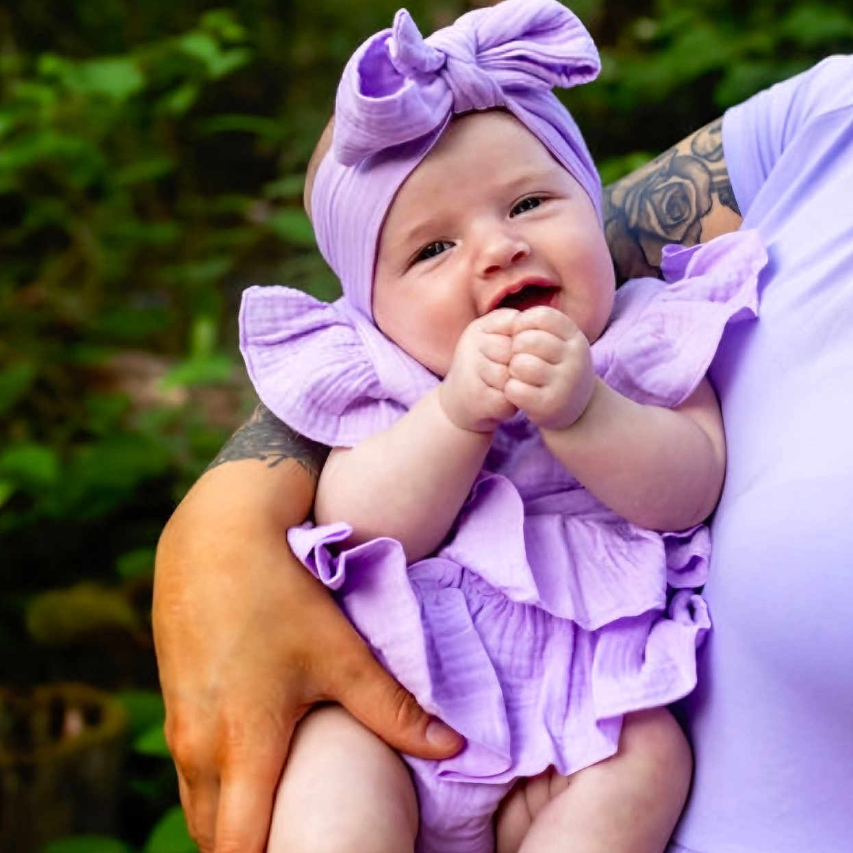 Oaklynn Grace is registered to the contest to win money with this photo: baby, bodypart, bonnet, cap, clothing, dress, face, finger, hand, happy, hat, head, newborn, person, photography, portrait, purple, skin, smile, tattoo