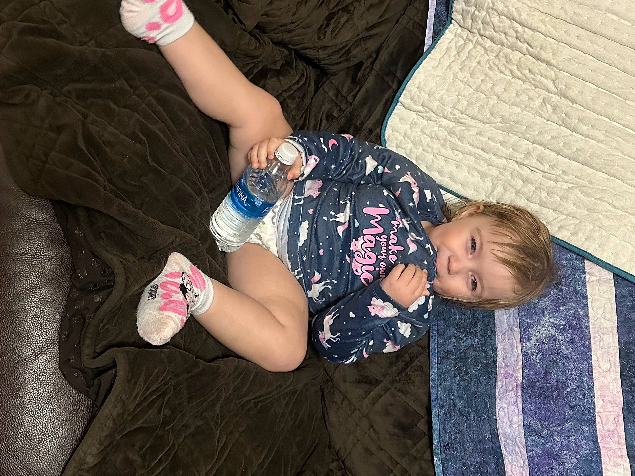 Noelle is registered to the contest to win money with this photo: baby_toddler_clothing, elbow, gesture, happy, human_body, human_leg, joint, knee, leg, nail, pattern, person, plant, sitting, sleeve, thigh, thumb, toddler, tree, trunk