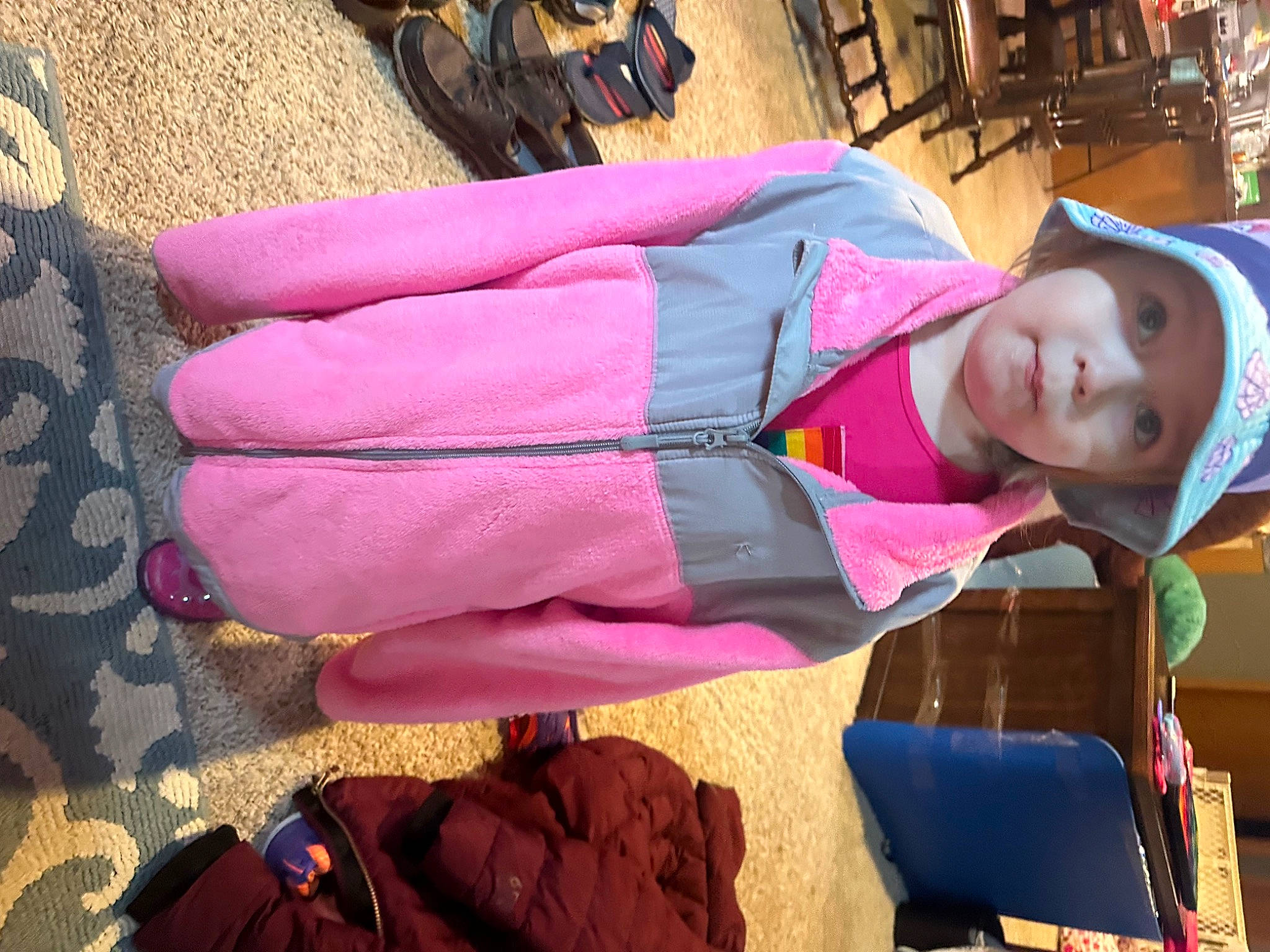 Noelle is registered to the contest to win money with this photo: baby, backpack, bag, child, clothing, headwear, jacket, leisure, linens, luggage_and_bags, magenta, pattern, person, pink, scarf, sitting, textile, toddler, travel, tree