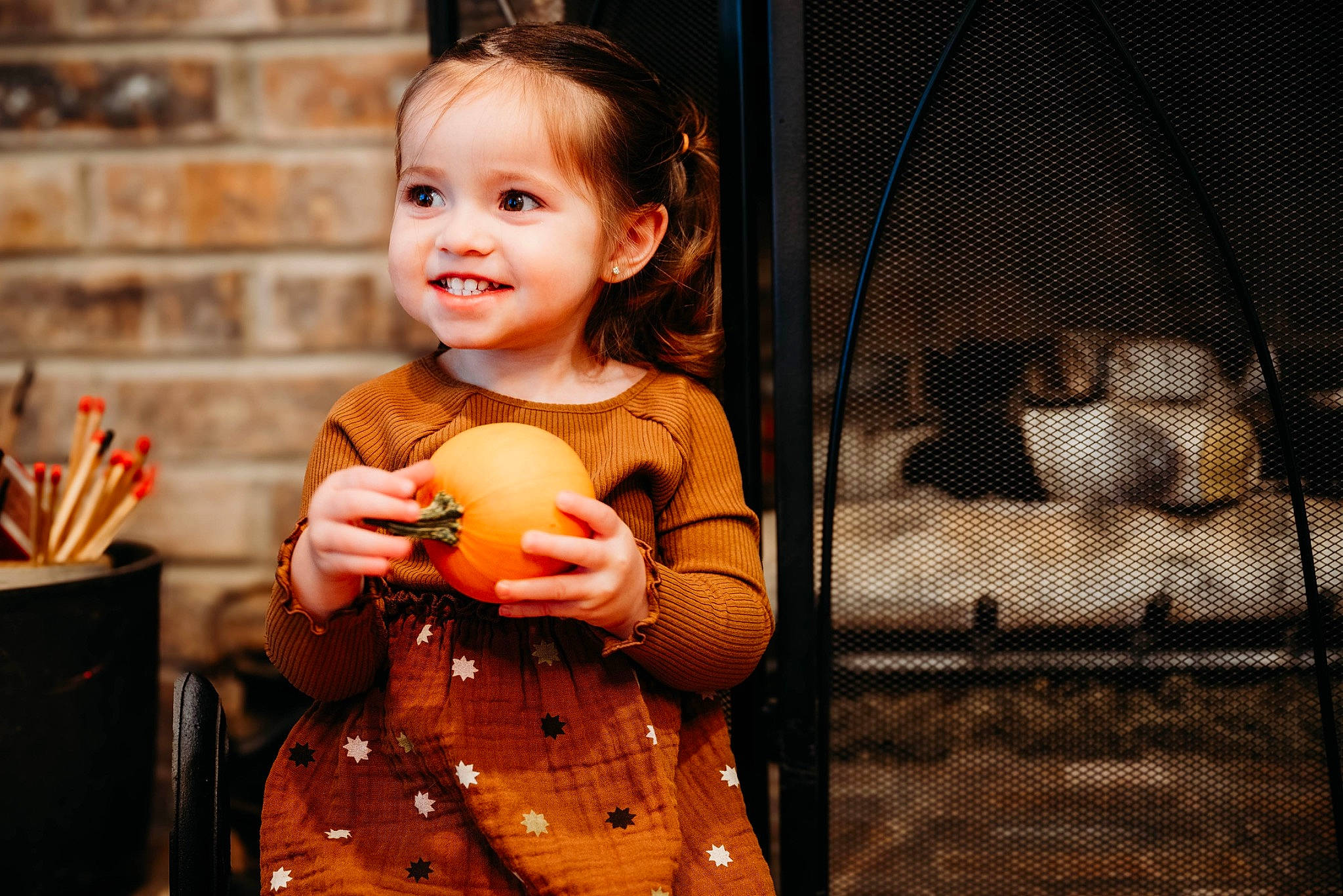 Taylynn is registered to the contest to win money with this photo: bracelet, child, event, fashion, flash_photography, formal_wear, fun, hand, happy, jewellery, joy, pattern, peach, person, plaid, portrait_photography, room, sitting, smile, t_shirt
