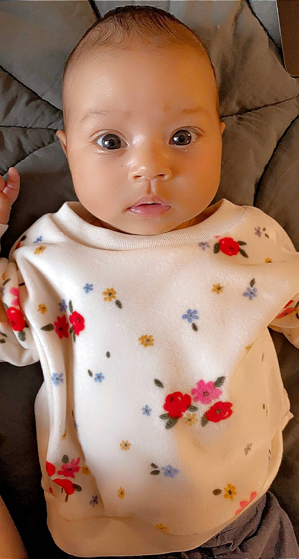 Esmé joined the competition — help win amazing prizes! baby, baby_products, baby_toddler_clothing, cheek, child, chin, facial_expression, finger, linens, lip, neck, pattern, person, petal, pink, product, skin, sleeve, textile, toddler