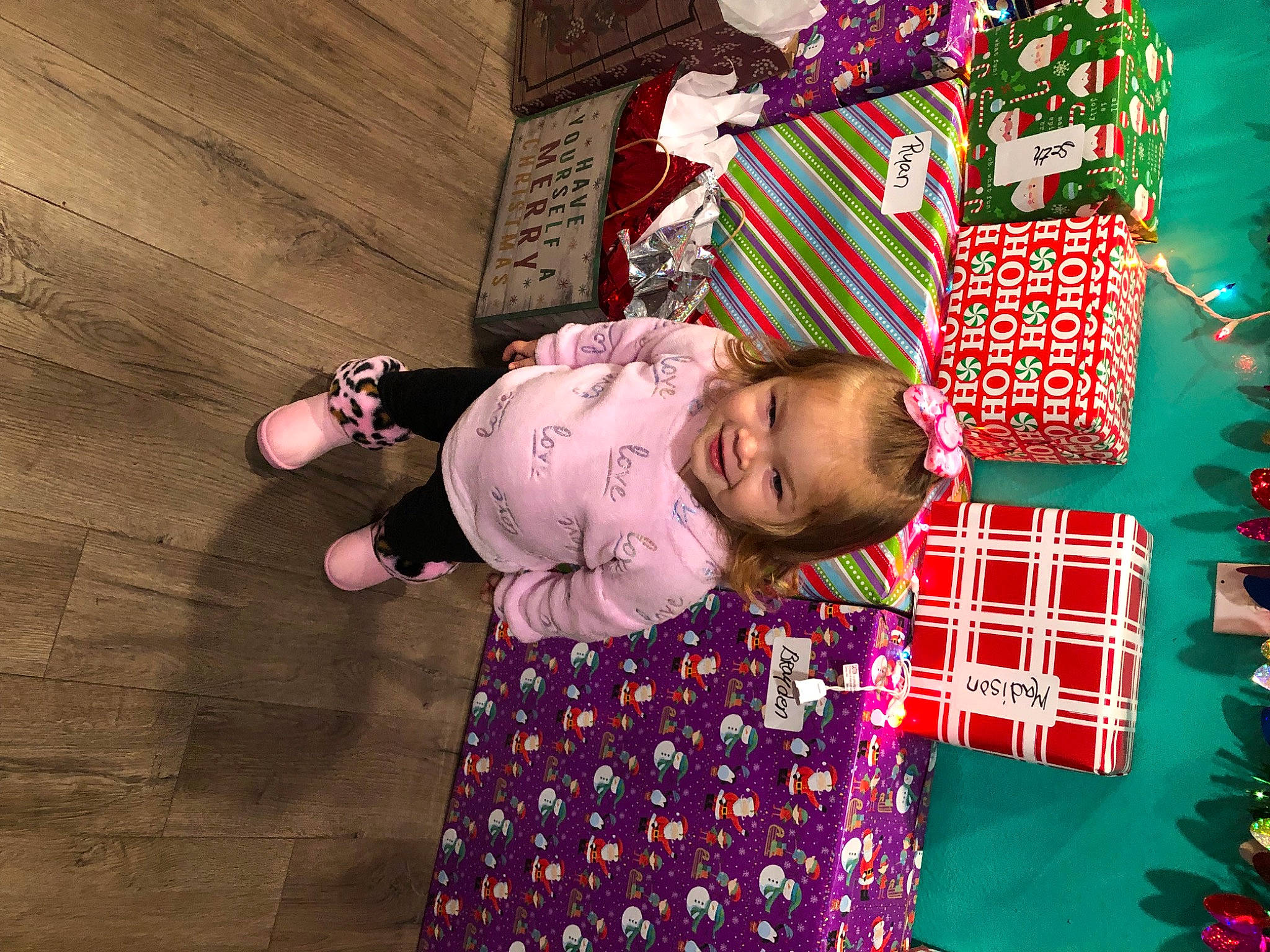 Saige is registered to the contest to win money with this photo: baby, baby_toddler_clothing, child, dress, event, flooring, fun, happy, hardwood, head, holiday, joy, magenta, pattern, person, pink, play, purple, room, sleeve