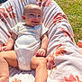 Halo is registered to the contest to win money with this photo: baby, infant, smiling, blanket, onesie, outdoor, grass, sunlight, portrait, cute, happy, face, cheeky, legs, feet, arm, fabric, pattern, relaxing, daytime