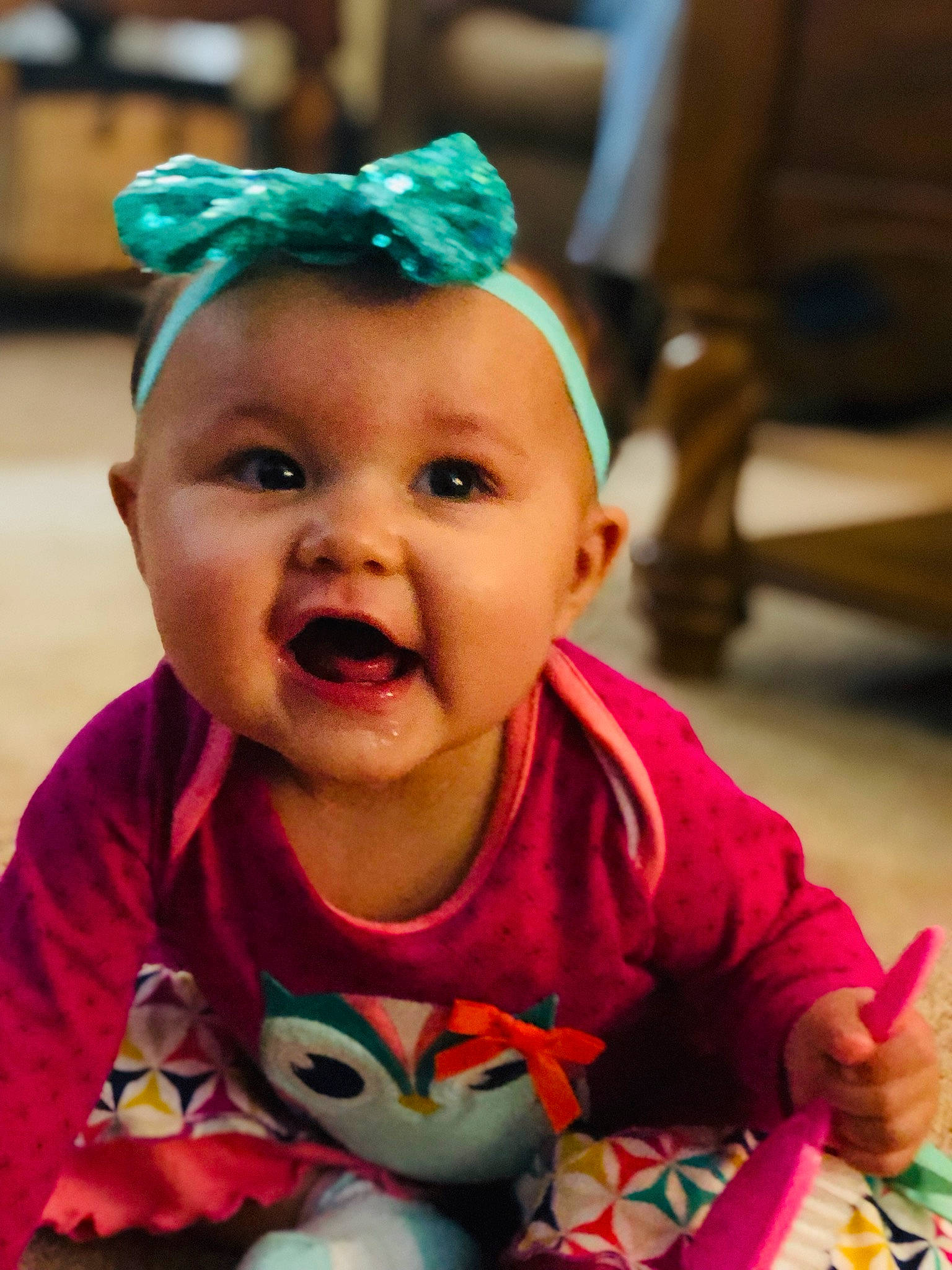 Katelyn is registered to the contest to win money with this photo: baby, baby_laughing, cheek, child, face, facial_expression, fashion_accessory, fun, hair_accessory, happy, head, headband, headgear, laugh, lip, mouth, person, pink, skin, smile