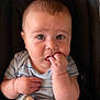 Graham Brewer is registered to the contest to win money with this photo: baby, infant, child, face, hand, fingers, onesie, striped_clothing, soft_toy, plush, sitting, curious, expression, portrait, closeup, skin, head, eyes, indoor, background