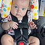 baby, blue_eyes, car_seat, child, chubby, closeup, clothing, cushion, cute, floral_pattern, foot, hand, head, indoor, infant, person, portrait, safety_harness, seatbelt, skin
