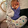 newborn, baby, sleeping, blanket, hospital, incubator, medical_tube, heart_pattern, cushion, infant, swaddled, peaceful, child, face, healthcare, resting, cute, tiny, purple, closeup
