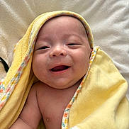 Arnaud participe au concours pour gagner de l'argent avec cette photo : baby, blanket, child, closeup, comfort, cute, expression, face, happy, indoors, infant, joy, newborn, portrait, skin, smiling, soft, towel, wrapped, yellow