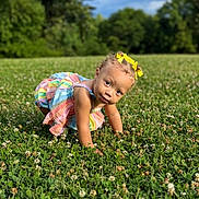 Truce joined the competition — help win amazing prizes! toddler, child, grass, field, outdoor, greenery, clover, yellow_bows, colorful_dress, crawling, nature, sky, clouds, summer, portrait, cute, curious, young_child, daylight, playful