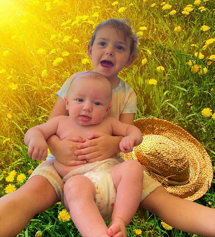 Raeleigh joined the competition — help win amazing prizes! abdomen, baby, child, flower, grass, grass_family, grassland, green, hairstyle, happy, meadow, people_in_nature, person, plant, playing_with_kids, prairie, sitting, summer, thigh, toddler