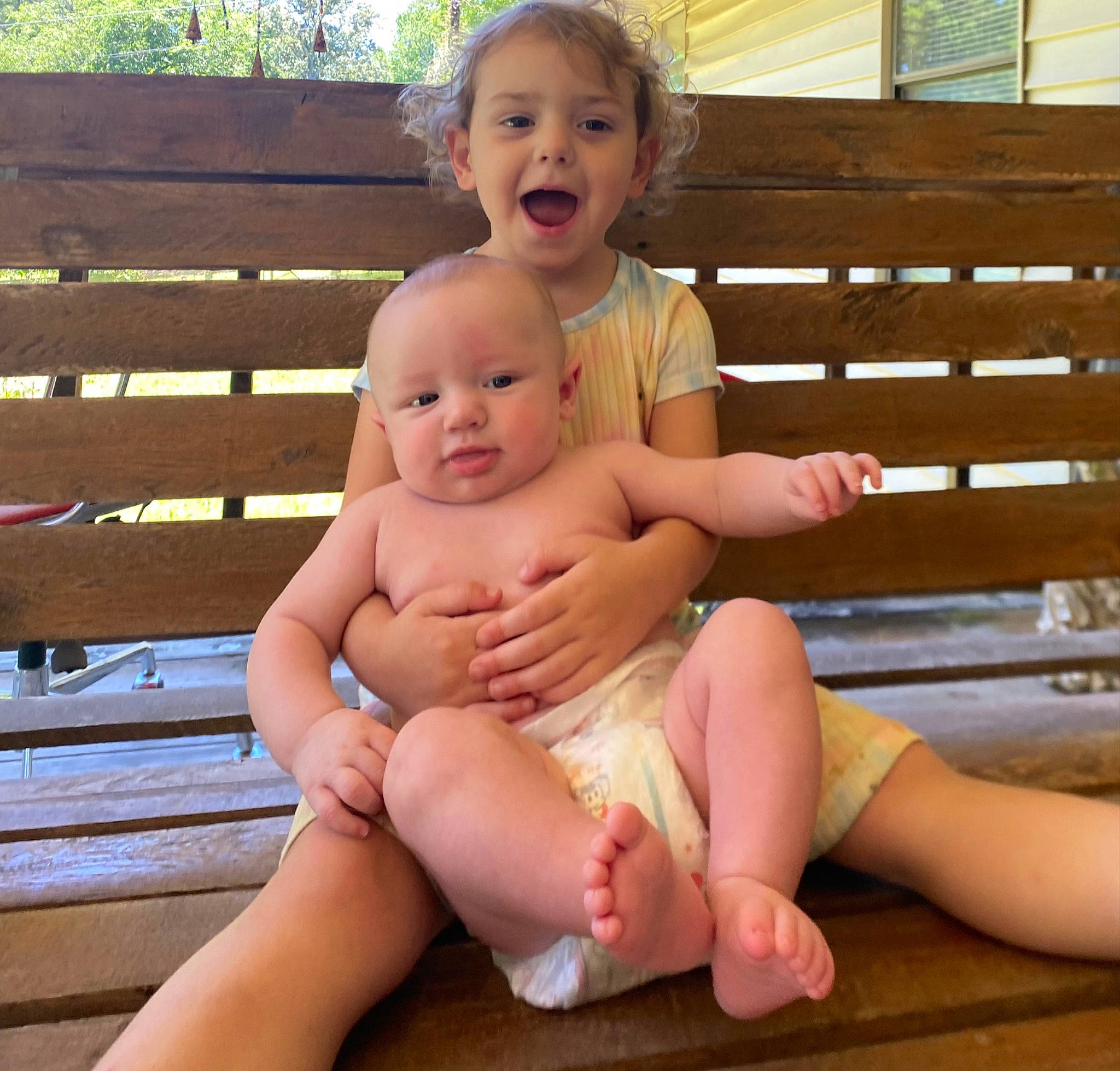 Connor is registered to the contest to win money with this photo: eye, face, facial_expression, finger, hairstyle, happy, head, joint, knee, lap, leg, muscle, neck, person, skin, smile, stomach, thigh, thumb, vertebrate