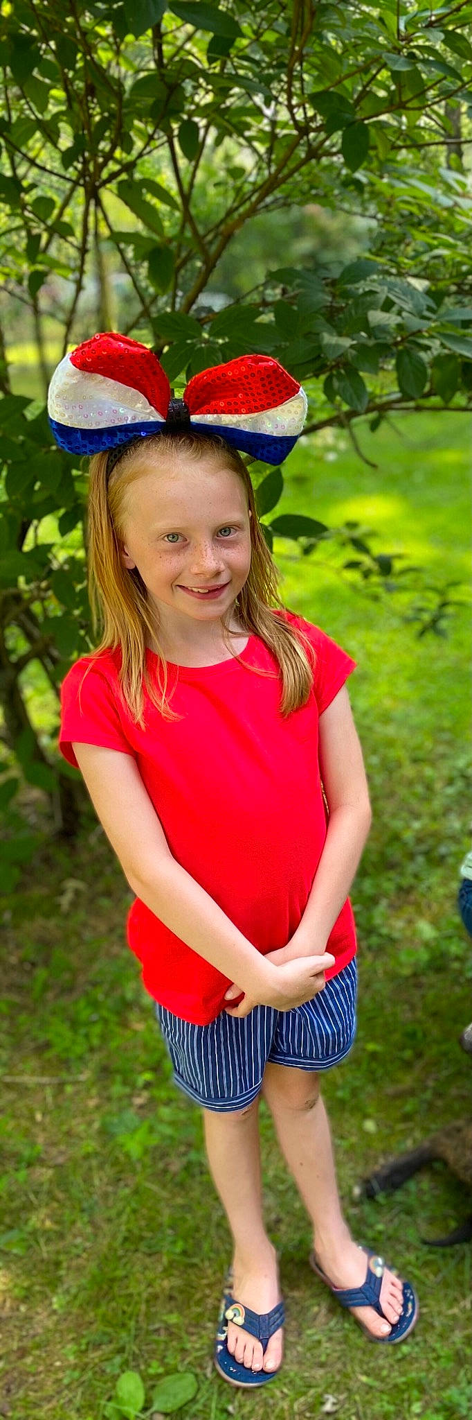 Jazmine is registered to the contest to win money with this photo: blond, blue, costume_hat, eye, face, facial_expression, fun, grass, hair, happy, head, human_body, joy, leaf, long_hair, neck, people_in_nature, person, pink, smile