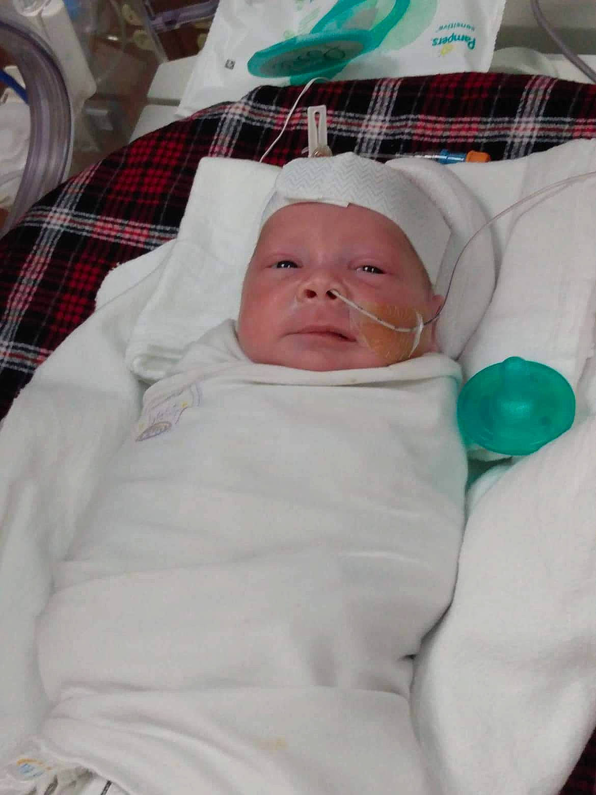 Cain joined the competition — help win amazing prizes! baby, baby_safety, baby_sleeping, baby_toddler_clothing, cheek, child, comfort, dishware, event, green, headwear, hospital, human_body, linens, medical, person, serveware, service, tableware, textile