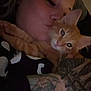 Cheeto Moe Nico joined the competition — help win amazing prizes! affection, animal, cat, close_up, cozy, cute, eyelashes, face, feline, fur, human, indoor, love, orange_tabby, person, pet, skin, snuggling, tattoo, whiskers