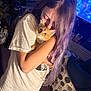 affection, carpet, casual, cat, clothing, couch, cozy, curious, furniture, home, hug, indoor, kitten, long_hair, orange_cat, person, purple_hair, shorts, television, tshirt